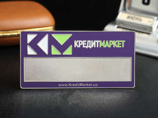 Name badge "CreditMarket"
