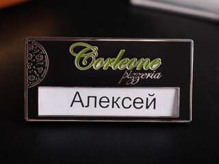 Name badge with logo "Corleone"