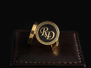 Cufflinks with the initials "RD"