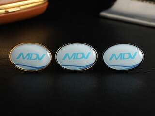 Значок с логотипом "MDV"